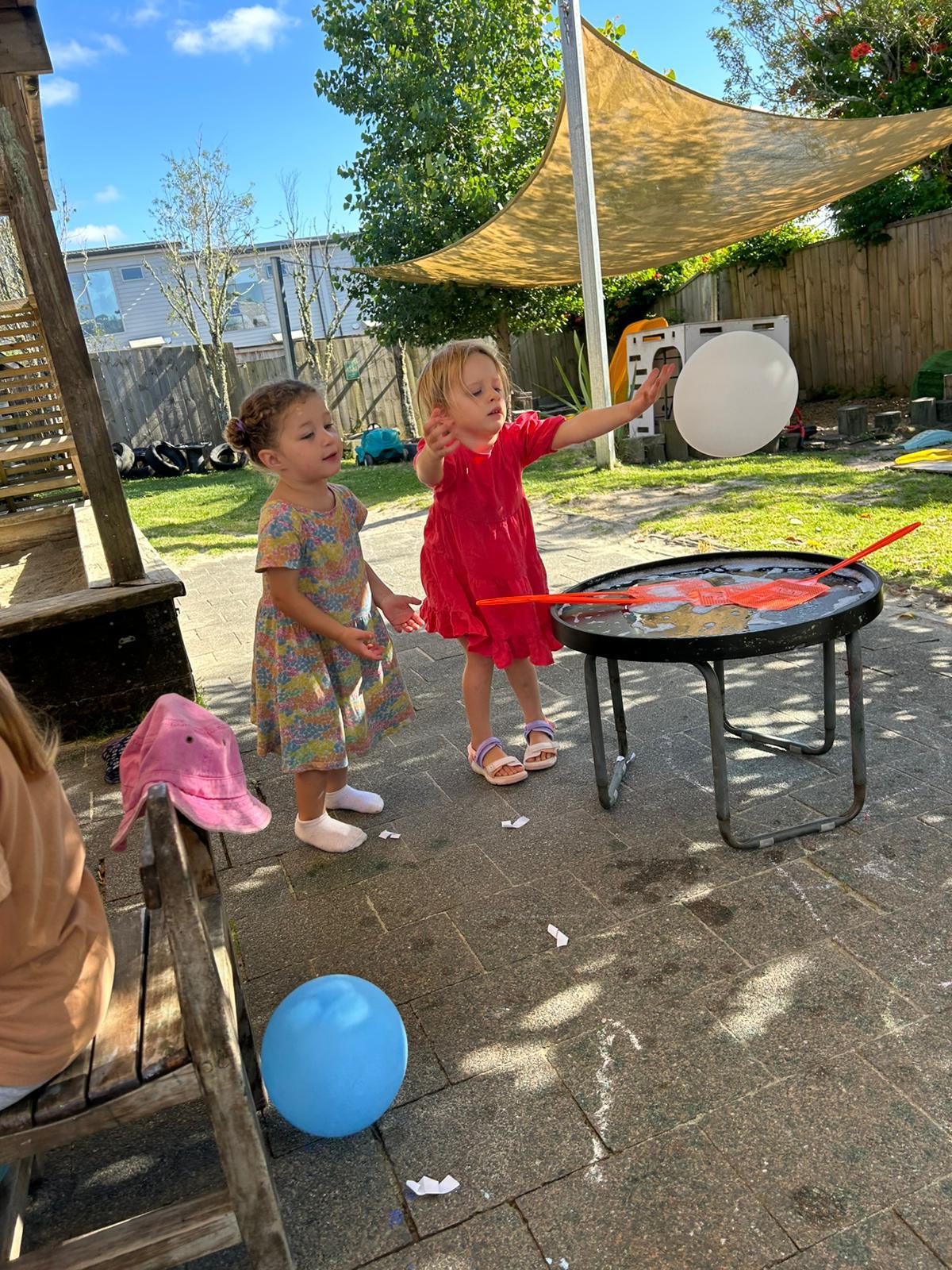 Outdoor and indoor learning moments at Little Village